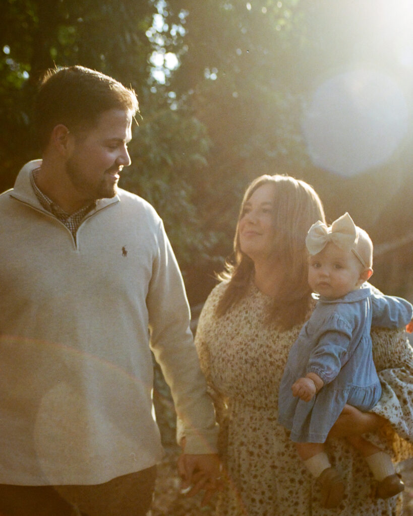 family walks in downtown huntsville al with baby