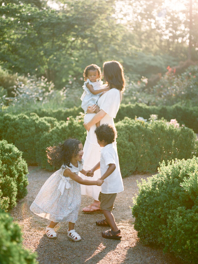 mother and children dance in rose garden in decatur alabama by fauna & film