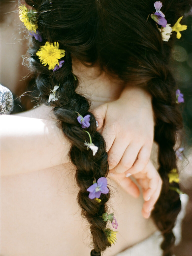 A closeup of a child's hands around her mother's neck, taken by Huntsville motherhood photographer Fauna & Film