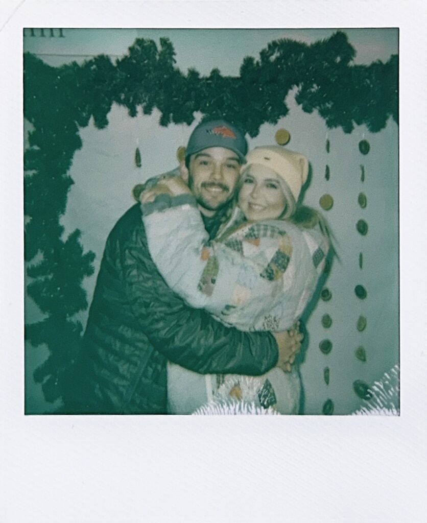 couple shares hug at fauna & film huntsville photo booth