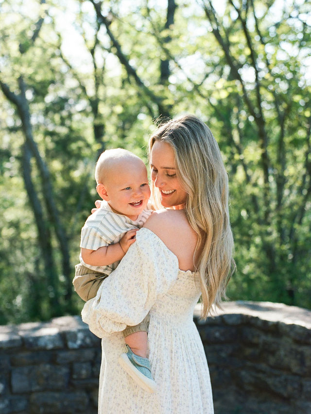 mother and toddler son share smile and embrace at monte sano state park